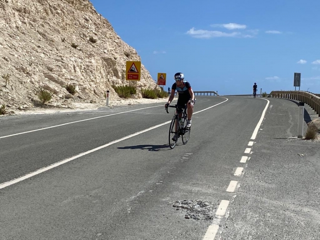 Skipper coming up over the top of the coastal road